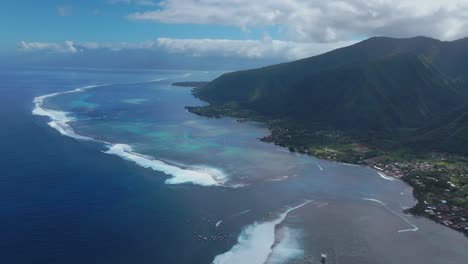 Coastal-Teahupoo-Tahiti-aerial-drone-view-new-judge-tower-surfing-contest-Point-Faremahora-Pass-Havae-French-Polynesia-coral-reef-surf-break-waves-Pacific-Ocean-channel-boats-cloudy-sunny-circle-left