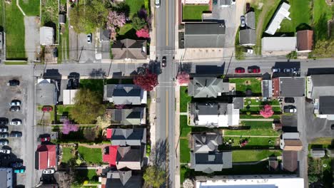 Aerial-top-down-of-american-city-with-main-street-during-sunny-day-in-spring