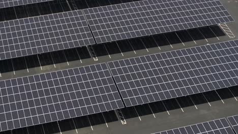 Solar-panels-built-over-parking-lot,-innovative-alternative-energy-source