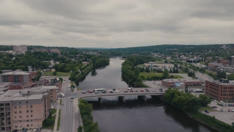 Highway-Bridge-Over-Magog-River-In-Sherbrooke,-Canada---Aerial-Drone-Shot