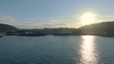 Aerial-Orbiting-shot-of-Cape-Quejo-landscape-during-morning-sunlight,-Cantabria