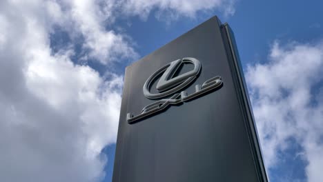 Lexus-logo-sign-against-a-bright-blue-sky,-Exeter,-Devon,-UK,-June-2024