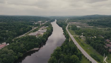 Tranquil-Scenery-Of-Magog-River-In-Sherbrooke,-Canada---Aerial-Drone-Shot