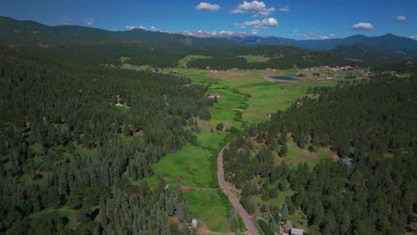 Mount-Blue-Sky-Evans-aerial-drone-Conifer-Evergreen-Colorado-Rocky-Mountains-landscape-Spring-Summer-North-Turkey-Creek-Road-Traffic-Marshdale-sunny-morning-forward-pan-up-reveal-motion