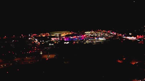 Aerial-View-Over-Belmont-Park-Illuminated-At-Night-In-San-Diego,-California---Drone-Shot