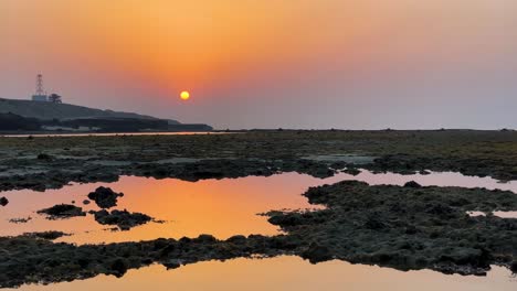 wonderful-sunrise-in-rock-cliff-seaside-beach-landform-tidal-concept-in-saudi-tourism-marine-landscape-tourist-attraction-in-iran-natural-panoramic-sunset-golden-time-in-Qatar-coral-reef-pond-hazy-day