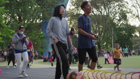 Crowd-Of-People-Doing-Fitness-Activities-And-Relaxing-At-Ahmad-Yani-Square-In-Tangerang-City,-Indonesia