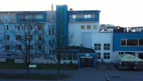 Viiking-SPA-Hotel-front-facade-in-aerial-pedestal-up-view-with-golden-sunlight