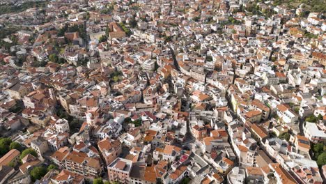 City-Streets-of-Italian-Mountain-Village-of-Dorgali,-Sardinia,-Aerial-View