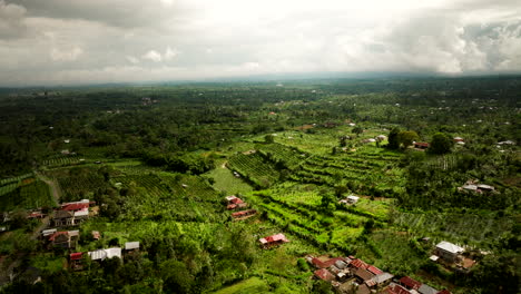 Fly-Over-Kintamani-Countryside-Town-Near-Mount-Batur-In-Bali,-Indonesia