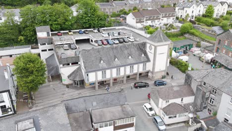 Aerial-view-of-The-Cooperative-supermarket-in-Tavistock,-highlighting-the-building-and-surrounding-area,-Devon,-UK,-June-2024