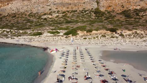 Fly-over-Balos-Beach-with-Tourists-in-Gramvousa-Peninsula,-Crete,-Greece