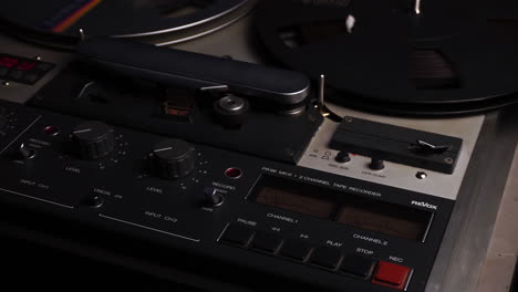 Professional-ReVox-Reel-to-Reel-Audio-Recorder-and-Spinning-Tape,-Close-Up