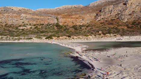 Orbital-of-Balos-Beach-and-Lagoon-with-Tourists-in-Gramvousa-Peninsula,-Crete,-Greece