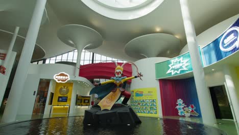 Statue-of-Monkey-King-at-JC-Cartoon-Art-Museum-Entrance-in-a-reveal-tilt-down-shot