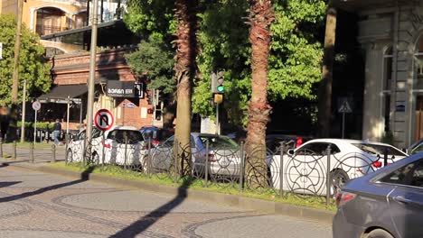 Daytime-scene-of-car-traffic-moving-along-the-streets-of-Batumi,-Georgia,-illustrating-urban-mobility-and-daily-life-in-a-bustling-city