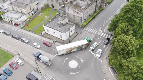 Police-stop-HGV-lorry-at-a-roundabout-in-Tavistock,-causing-a-traffic-disruption-and-managing-the-situation,-Devon,-UK,-June-2024