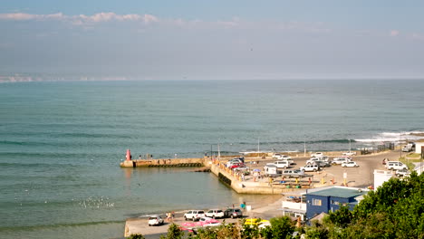 High-angle-telephoto-view-over-small-Still-Bay-West-harbour,-South-Africa