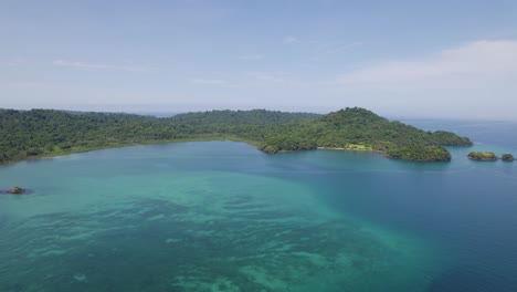 Coiba-island-in-panama-with-lush-greenery-and-clear-turquoise-waters,-aerial-view