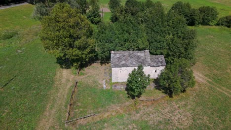 Aerial-shot-of-the-historic-Novalesa-Abbey-Chapel-located-in-the-scenic-Turin-region-of-Piedmont,-Italy