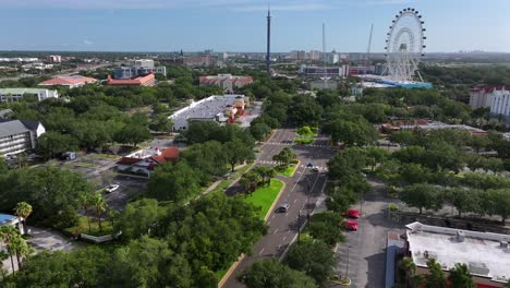 Aerial-approaching-shot-of-cars-on-street-of-Orange-County-Convention-Center,-Orlando