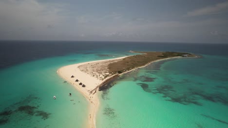 A-tropical-island-with-white-sandy-beaches-and-turquoise-waters,-aerial-view