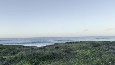 A-tranquil-view-of-a-coastal-pathway-on-Oahu,-Hawaii,-at-sunset