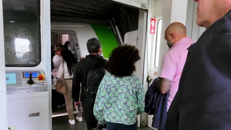 Brazil,-Pará:-View-of-the-airplane-entrance,-with-passengers-still-in-the-jet-bridge