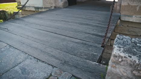 close-up-of-the-wooden-drawbridge-of-Varaždin's-Old-Town,-showcasing-its-historic-charm-and-weathered-texture