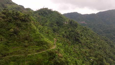 Amed-Bali’s-tranquil-east-coast,-mountainside-village-buildings,-aerial