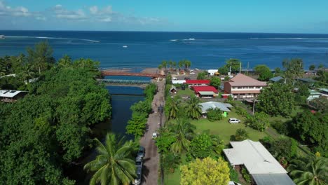 Teahupoo-Tahiti-French-Polynesia-aerial-drone-view-end-of-the-road-new-Olympics-pedestrian-bridge-van-car-drive-island-coast-to-Papeete-morning-sunny-bay-channel-coral-reef-valley-river-forward-motion