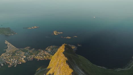 Reinebringen-peak-with-township-bellow,-aerial-drone-view