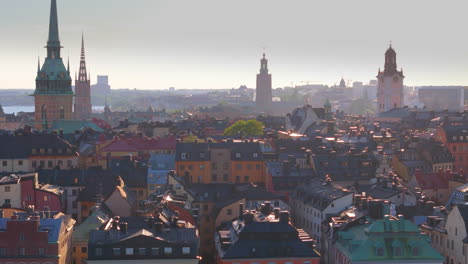 Sunset-aerial-skyline-of-Gamla-Stan-with-church-towers-and-colorful-buildings