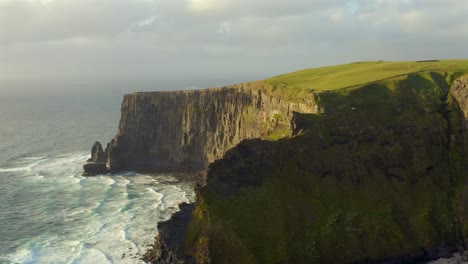 Northern-Cliffs-of-Moher,-windy-and-wavy-evening,-aerial-view