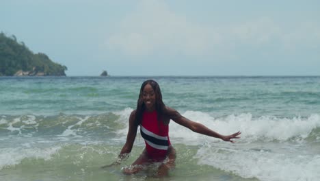 A-young-girl-in-a-Trinidad-flag-bikini-is-seen-on-a-beach-on-the-north-coast-of-Trinidad-in-the-Caribbean