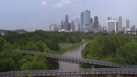 Establishing-drone-shot-of-the-Buffalo-Bayou-and-Houston,-Texas