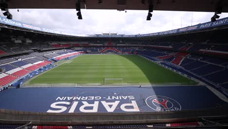 Soccer-stadium-at-Parc-des-Princes-home-of-Paris-Saint-Germain-Football-team,-Aerial-pedestal-lowering-shot