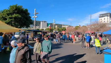 Weekend-market-with-busy-crowds-of-people-visiting-food,-coffee-and-local-produce-stalls-in-capital-city-of-Wellington,-New-Zealand-Aotearoa