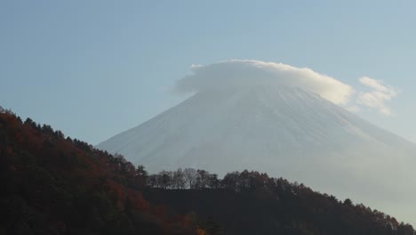 Mount-Fuji-with-a-cloud-cap-and-autumn-trees-in-the-foreground