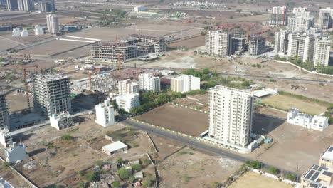 Drone-camera-moving-to-the-side-where-a-lot-of-different-construction-work-is-going-on