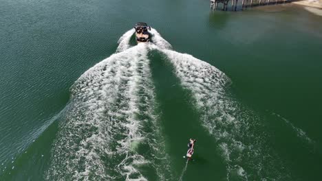 Person-Riding-Hydrofoil-Surfboard-On-Lake-DeFuniak-In-DeFuniak-Springs,-Florida