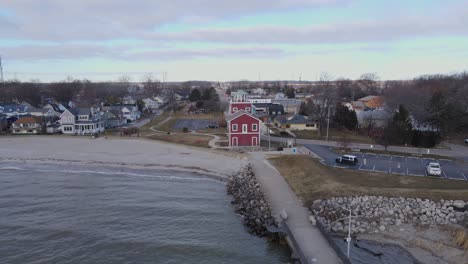 Scenic-Beachfront-with-Iconic-Red-Lighthouse-at-Luna-Pier,-Michigan,-USA