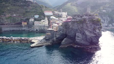 Aerial-footage-revealing-the-colorful-village-of-Vernazza-and-its-scenic-harbor