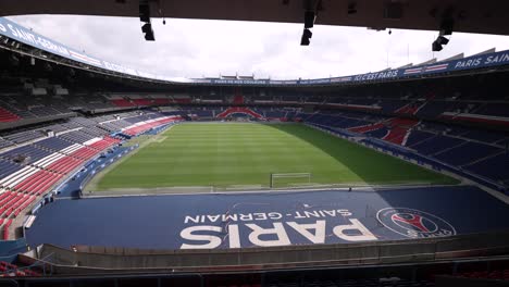 Soccer-stadium-end-view-at-Parc-des-Princes-home-of-Paris-Saint-Germain-Football-team,-Aerial-dolly-left-shot