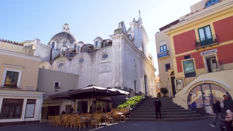 People-enjoying-at-the-city-square-of-Capri-Island-on-a-sunny-winter-day---Italy