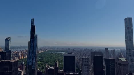 Panning-shot-of-Central-Park-and-some-skyscrapers,-like-Central-Park-Tower,-One57,-and-432-Park-Avenue-Tower-building-in-New-York,-Summer-2024