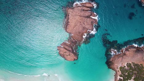 4K-Aerial-Drone-Video-circling-around-Twilight-Beach,-blue-crystal-clear-ocean-surrounds-the-white-sand-beach-and-rocks-in-Esperance,-Western-Australia