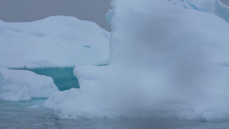 Icebergs-Near-Coast-of-Antarctica-on-Snowy-Day,-Close-Up