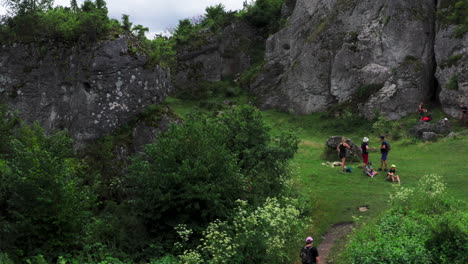 Drone-shot-reveals-Góra-Zborów-rocky-hill-with-tourists-enjoying-the-natural-landscape-within-the-Kroczyce-Okupne-village