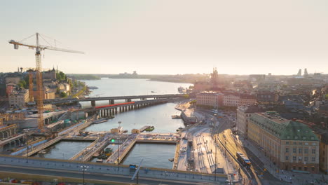 Construction-site-with-crane-between-Slussbron-and-Centralbron-Stockholm,-aerial